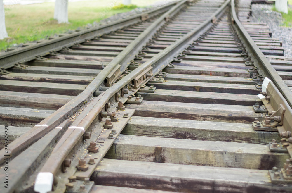 Fototapeta premium Rails and railway sleepers arrow