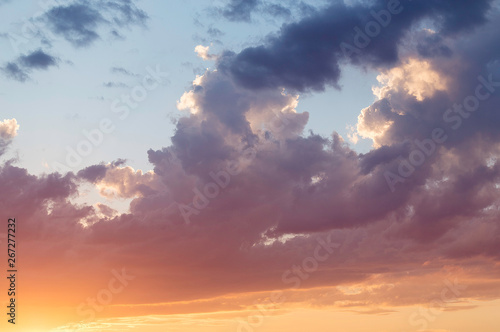 Sunny summer sunset on a cloudy sky. Bright, colorful, exciting. Big, huge cloud © Ольга Осинцева