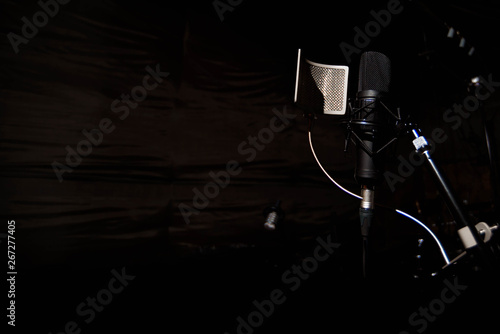 Close up studio condenser microphone with pop filter and anti-vi