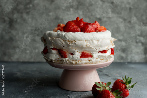 Pavlova cake topped with strawberries.