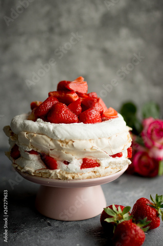 Cake with strawberries. Dark background.