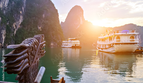 Cruise sun ship wooden junk sailing Ha Long Bay, Dragon Vietnam UNESCO World Heritage Site.