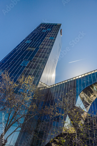 Detail of office building exterior. Business buildings skyline looking up with blue sky. Modern architecture apartment. 