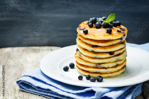 Blueberry Ricotta Pancakes with fresh blueberries and cup of coffee