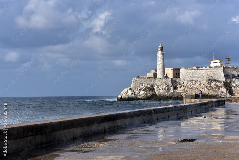 Big waves hitting Malecon, Havana, Cuba and Morro Castle at the background, Havana, Cuba