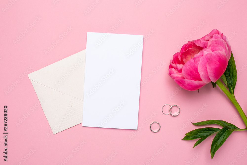 Greeting card with a beautiful flower peony and women's accessories on a pastel pink background.Fashion summer colour. Greeting card with a beautiful flower peony and women's accessories on a pastel pink background.Fashion summer colour.
