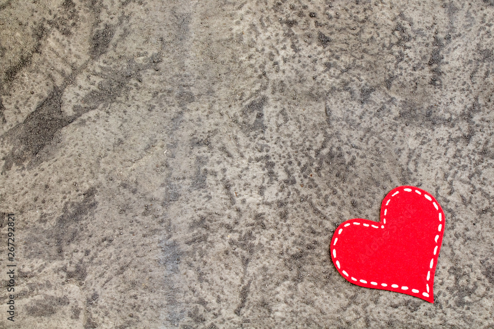 Red hearts on gray concrete background. Copy space. Top view. Red hearts on gray concrete background. Copy space. Top view.