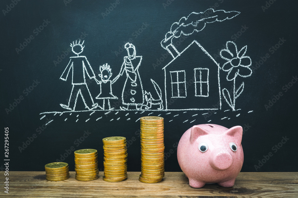 Ceramic piggy bank with gold money and Child's drawing - family near home