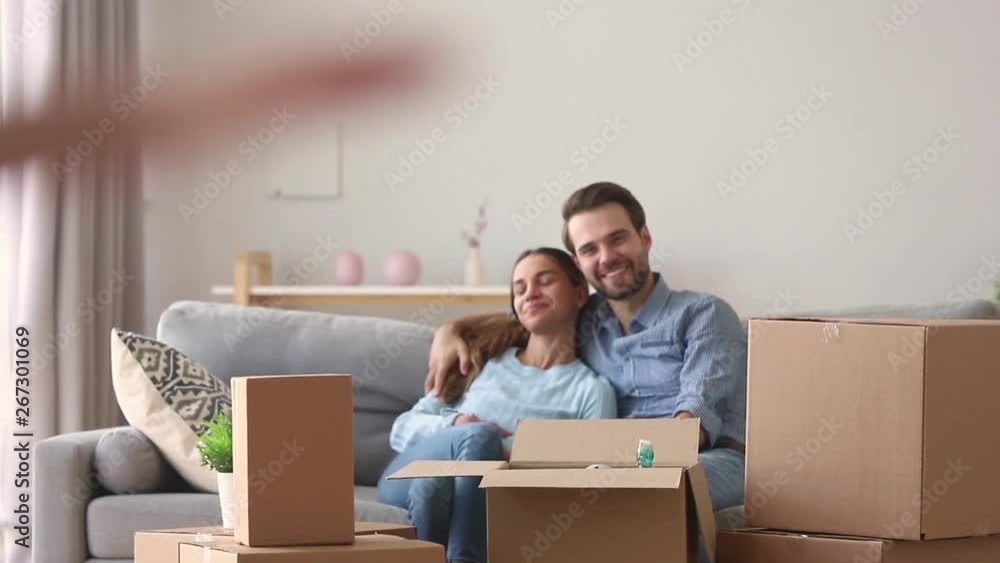 Happy kid exploring new house with parents on moving day Happy kid exploring new house with parents on moving day