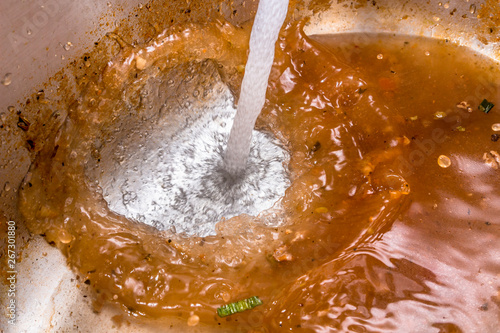 Fresh water being poured into sewage water