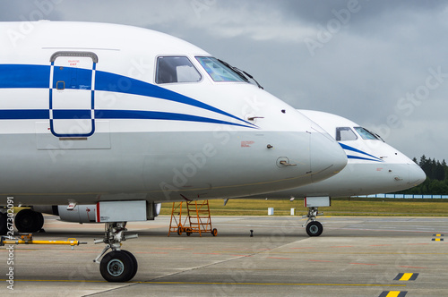 Nose of the two aircraft, standing on the apron of the airport