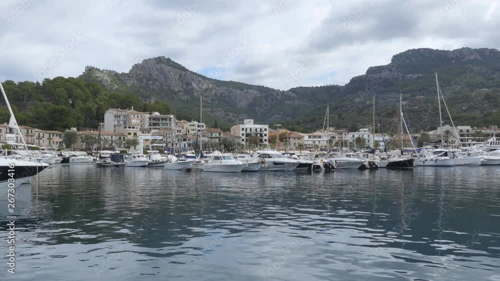 A city harbour with mountains in the background. A city harbour with mountains in the background.