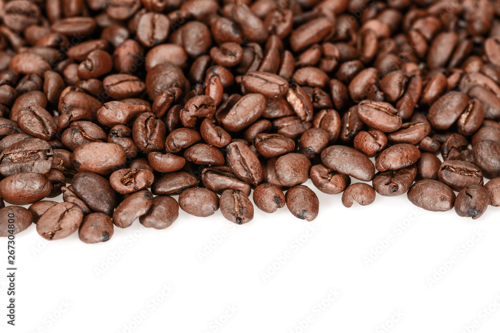 Brown roasted coffee beans, close up, isolated on a white background Brown roasted coffee beans, close up, isolated on a white background