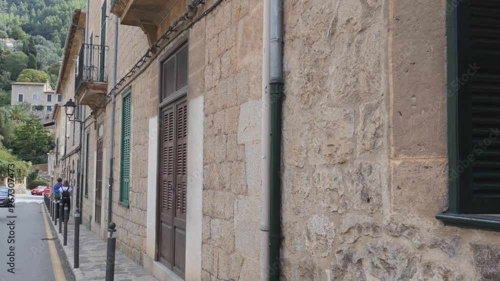A street in Spain with stone terraced houses. A street in Spain with stone terraced houses.