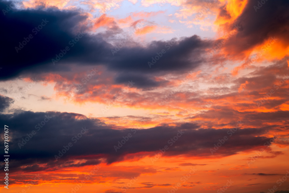 colorful dramatic sky with clouds at sunset.