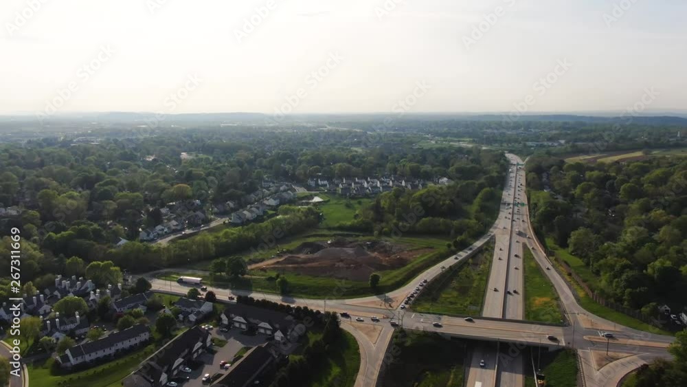 Lancaster county, Aerial pan from town over busy highway to countryside golf course 4k Lancaster county, Aerial pan from town over busy highway to countryside golf course 4k