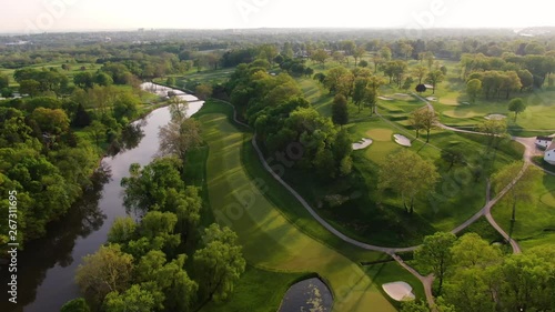 Early morning over golf course, aerial pan over gorgeous landscaping and woods in Lancaster, PA 4k photo