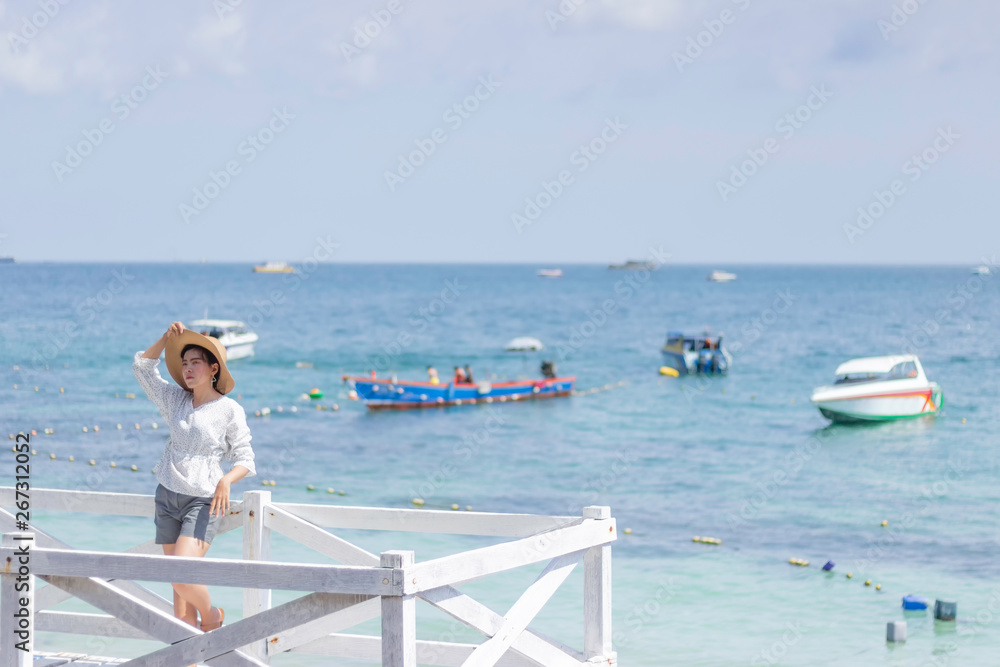 Young women traveling relax on the beach on summer, Concept beach on summer