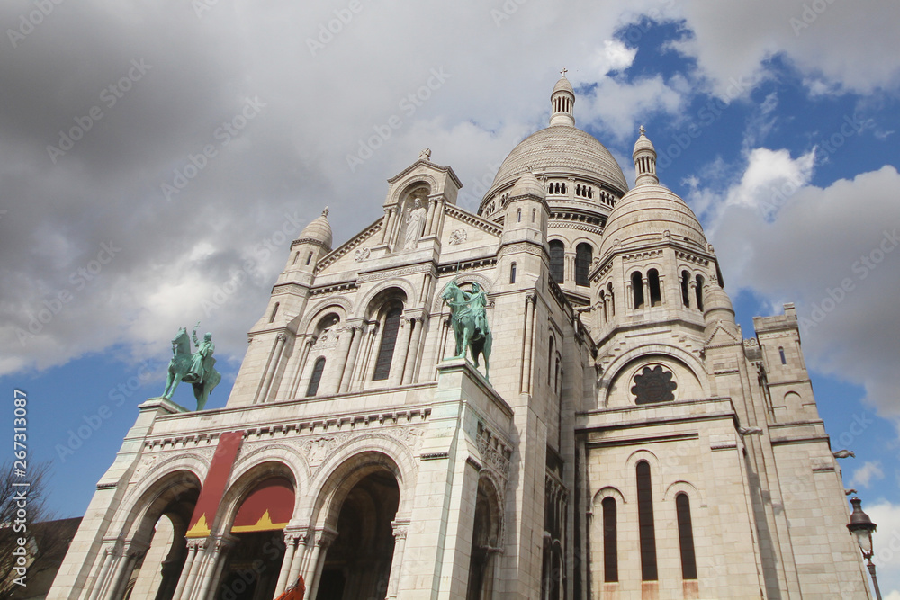 Sacre Coeur Basilica Church with Blue cloudy sky Backgrounds at Montmartre Hill, Paris France, White stone church, Sightseeing place, attractive, Travel destinations