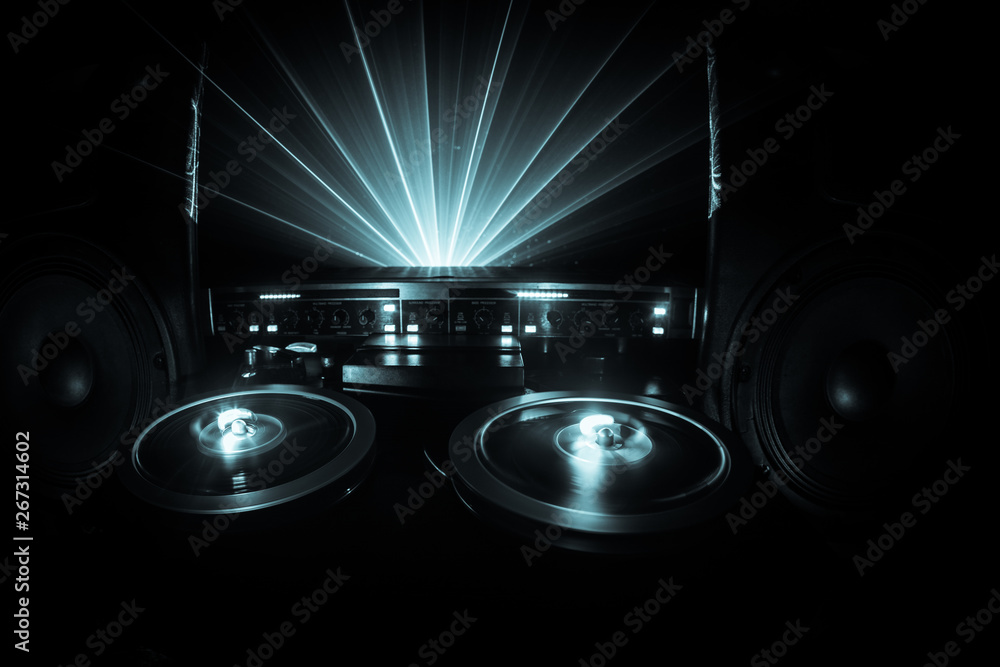 Old vintage reel to reel player and recorder on dark toned foggy  background. Analog Stereo Open Reel Tape Deck Recorder Player with Reels.  Stock Photo