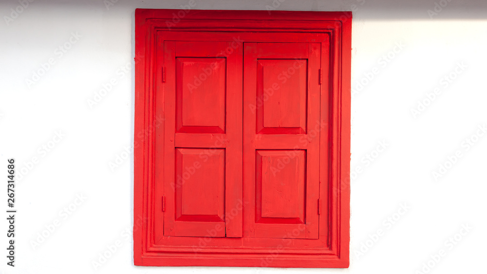 Old antique red windows On the Siemens white cement wall Old antique red windows On the Siemens white cement wall