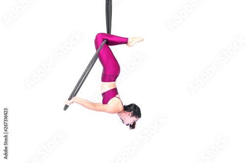 Beautiful woman Asian sport girl fly yoga posing on hoop isolated white background , Aerialist gymnastics performs physical exercises - yoga concept