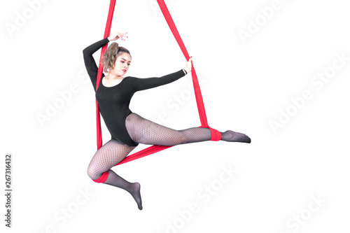 Beautiful woman Asian sport girl fly yoga posing on a red hammock isolated white background , Aerialist gymnastics performs physical exercises - yoga concept