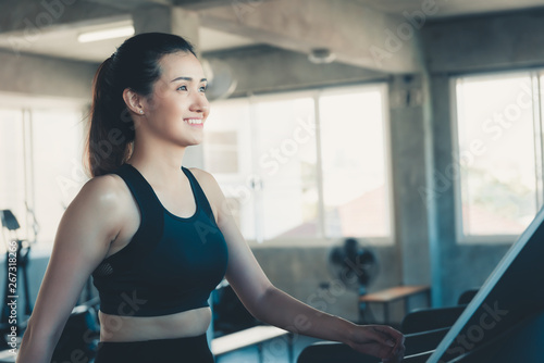 Sporty Woman is Workout Exercising in Fitness Club, Attractive Woman is Exercised Jogging and Running on Treadmill Machine in Gym. Sport Leisure Activities Lifestyles and Healthcare Concept. Free Download Sporty Woman is Workout Exercising in Fitness Club, Attractive Woman is Exercised Jogging and Running on Treadmill Machine in Gym. Sport Leisure Activities Lifestyles and Healthcare Concept. - GFXLoad