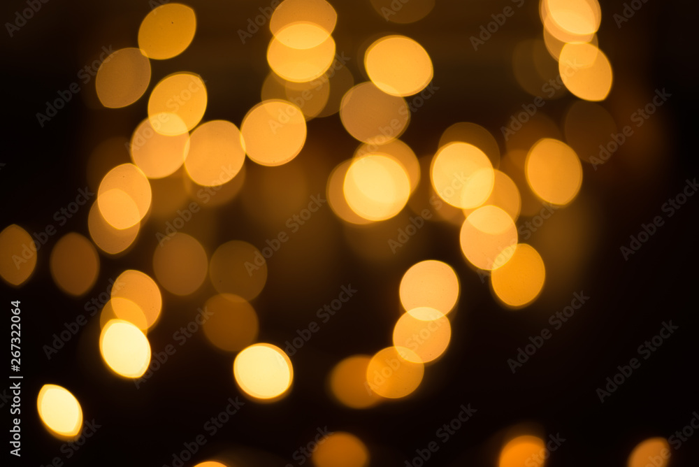 abstract gold bokeh light effect with dark background abstract gold bokeh light effect with dark background
