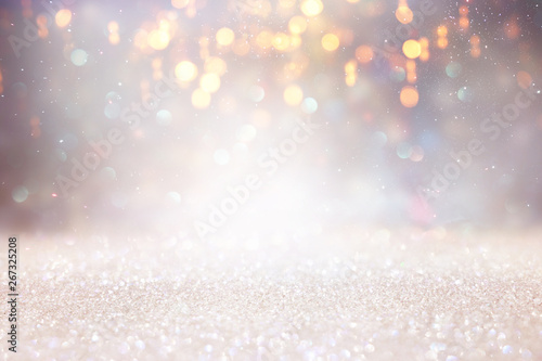 abstract glitter silver and gold lights background. de-focused © tomertu