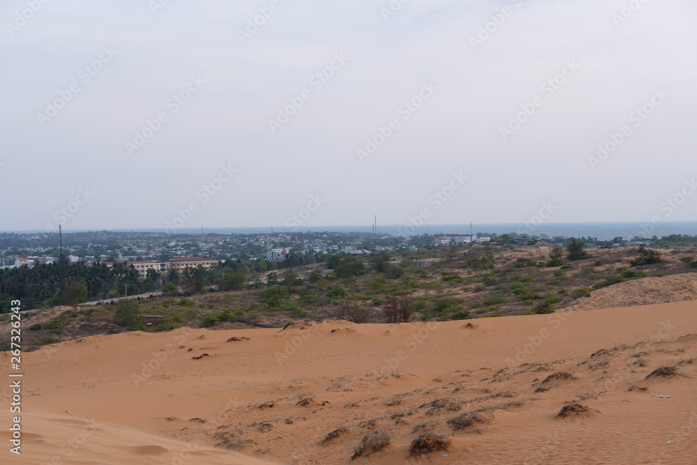 young woman relaxing at white sand dunes on sunset background young woman relaxing at white sand dunes on sunset background
