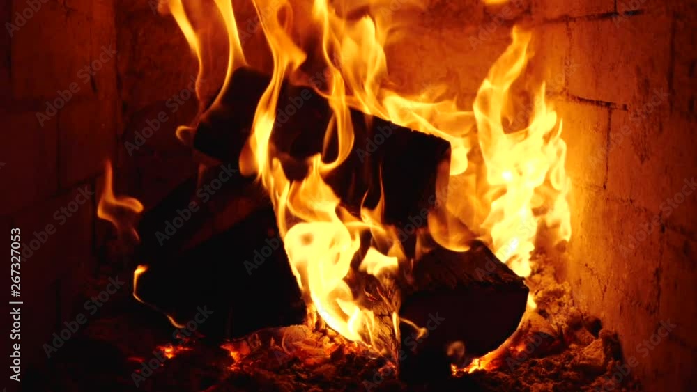 Fire burning with beautiful flames in stove - close up, slow motion, static camera