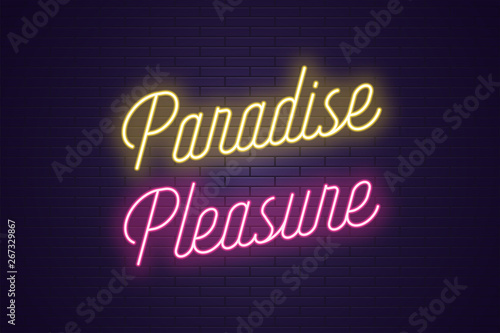 Neon lettering of Paradise Pleasure. Glowing text