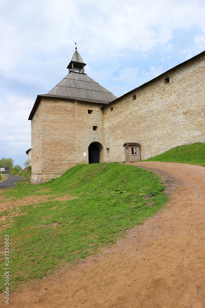 View to the wall and gate tower of old medieval Old Ladoga Fortress in Russia