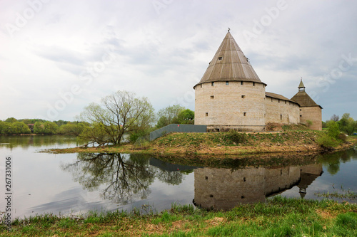 Beautiful spring view to medieval fortress Staraya  old  Ladoga  Russia with Volkhov river and reflection on the water