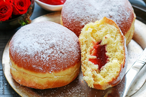 Fat Thursday celebration - traditional polish donuts filled with marmalade. photo