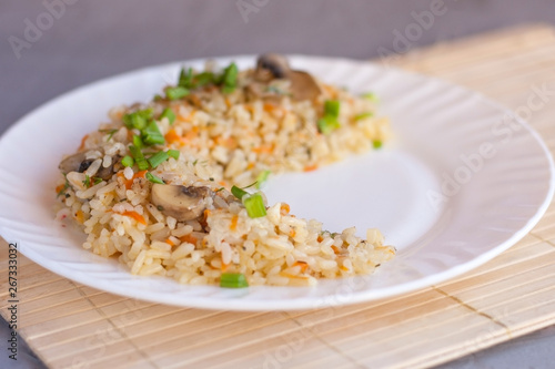 Pilaf is a traditional tasty dish made from roasted meat, onions, carrots, onions, and garlic.