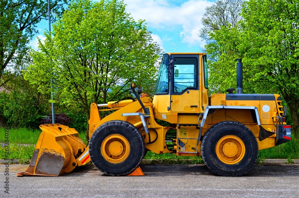 yellow construction machine with bucket