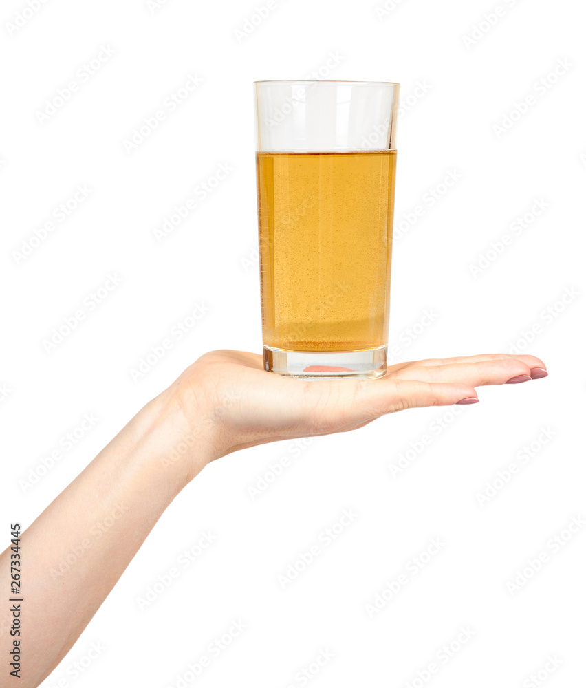 Hand with fresh apple juice in a glass, healthy beverage. Hand with fresh apple juice in a glass, healthy beverage.
