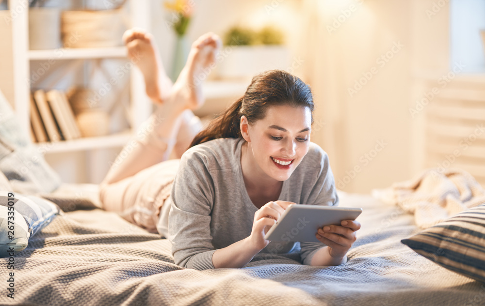 woman is working on tablet woman is working on tablet