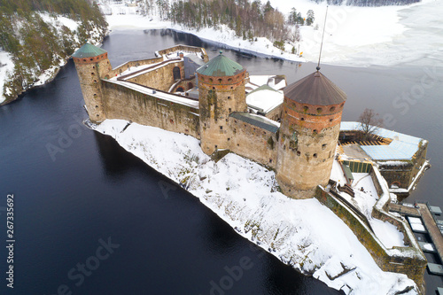 The old Olavinlinna fortress close-up on a March afternoon (aerial photography). Savonlinna, Finland photo