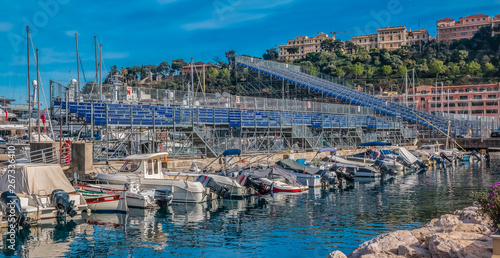 Monte Carlo panorama with luxury yachts and grand stands by the in harbor for Grand Prix F1 race in Monaco, Cote d'Azur