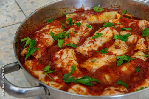 Cabbage rolls stuffed with rice and tomato sauce