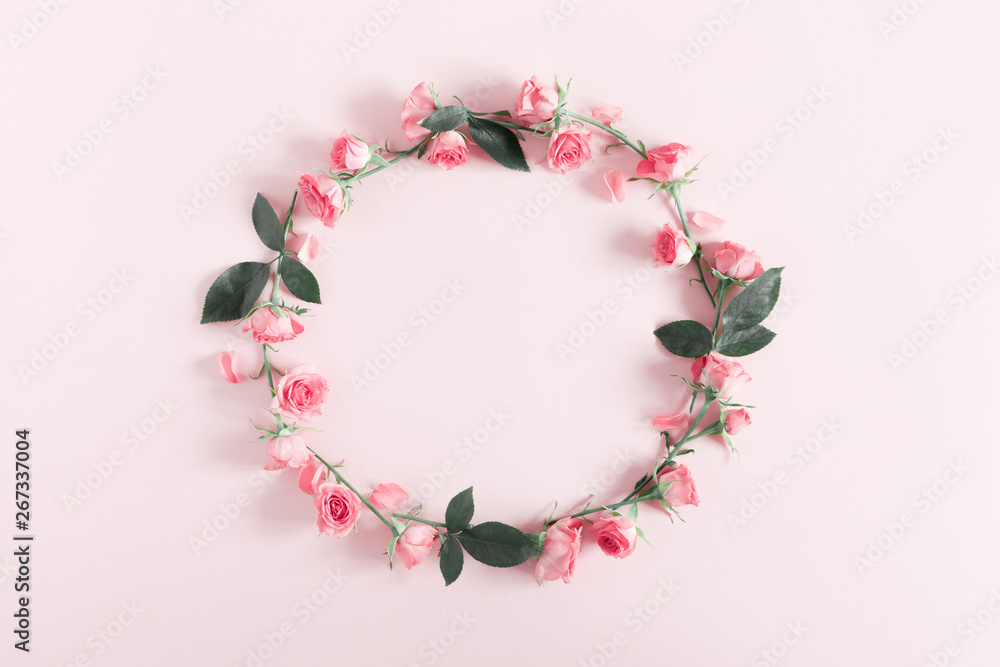 Flowers composition romantic. Wreath made of flowers pink roses on pastel pink background. Happy woman's day. Valentine's Day. Flat lay, top view, copy space