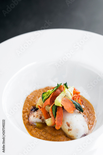 gourmet stuffed squid with vegetables in pumpkin curry puree