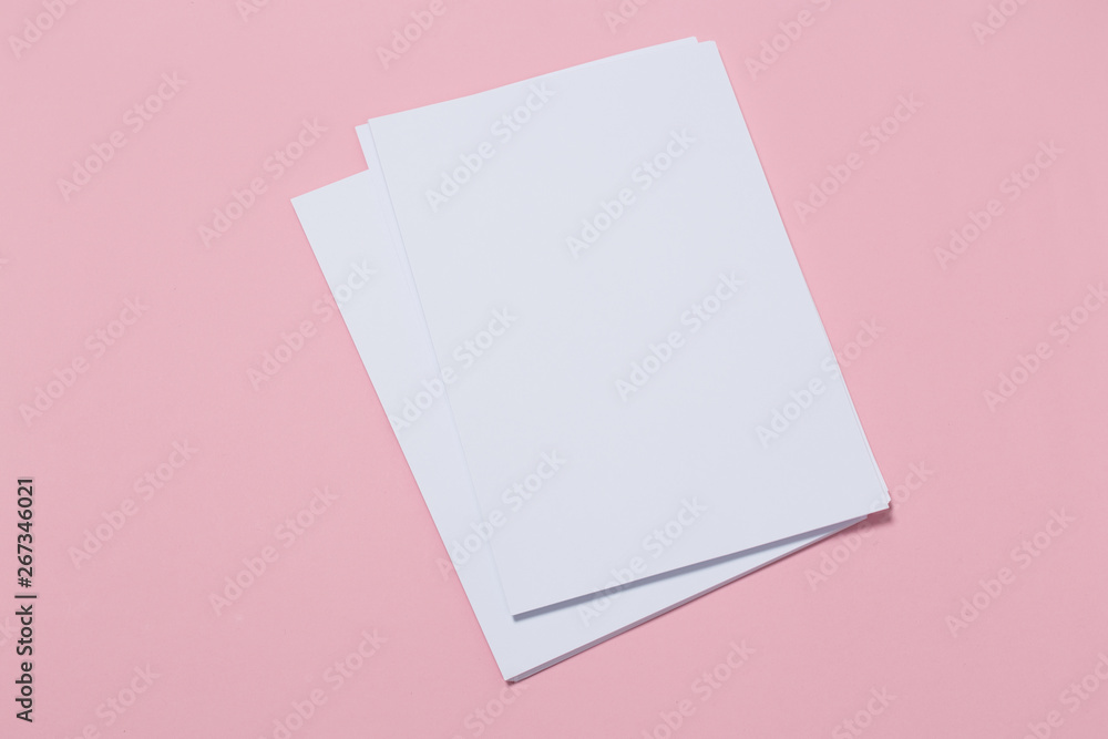 top view of a open notebook on a pink background. top view of a open notebook on a pink background.