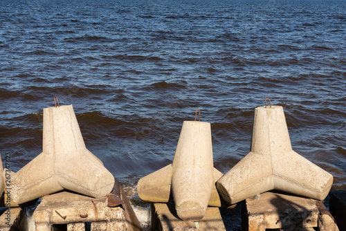 view of tetrapod stones on the sea shore to prevent coastal ersosion. photo