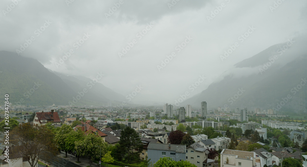 panorama view of the city of Chur on a miserable rainy overcast day in late April
