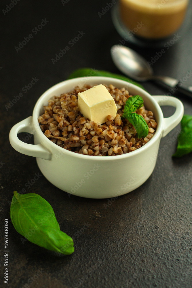 buckwheat porridge and a piece of butter (delicious food) homemade dish. food background. top buckwheat porridge and a piece of butter (delicious food) homemade dish. food background. top