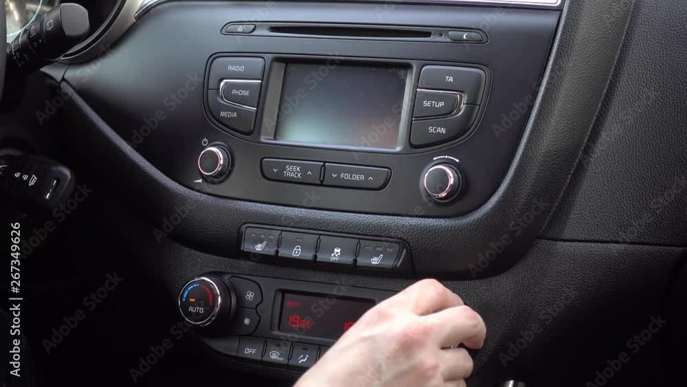 Regulation of the temperature in the car. 4K. Video has a glare from the sun and flicker panel Regulation of the temperature in the car. 4K. Video has a glare from the sun and flicker panel